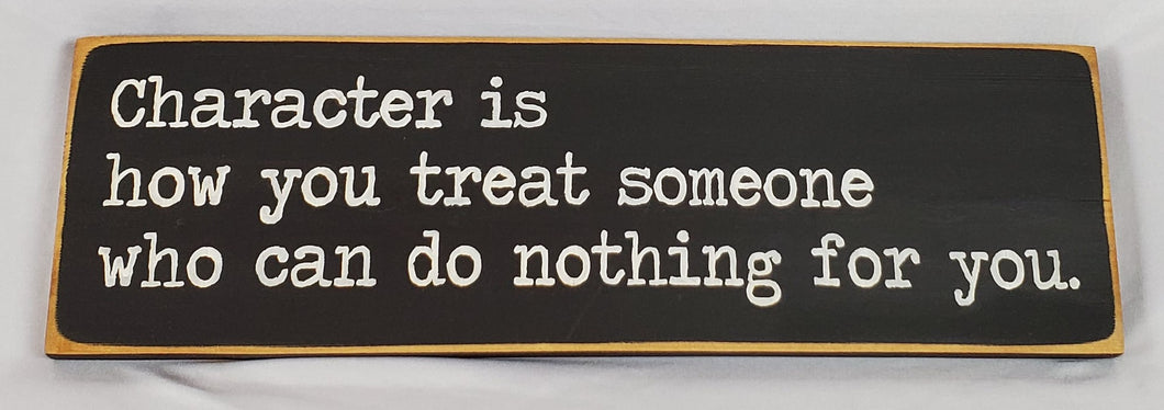 Character Is How You Treat Someone Who Can Do Nothing For You Wooden Sign