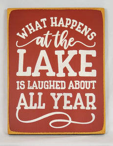 What Happens at the Lake Painted Wooden Sign