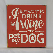 Load image into Gallery viewer, “I Just Want to Drink Wine and Pet My Dog” Funny handcrafted wood sign with an adorable paw print stamp and an image of a wine glass and bottle, 12x12 inches white font over Red. Rustic modern farmhouse home décor
