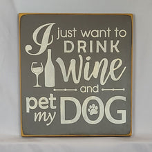 Load image into Gallery viewer, “I Just Want to Drink Wine and Pet My Dog” Funny handcrafted wood sign with an adorable paw print stamp and an image of a wine glass and bottle, 12x12 inches white font over Driftwood Grey.  Rustic modern farmhouse home décor 
