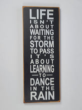 Load image into Gallery viewer, Life Isn&#39;t About Waiting for the Storm To Pass Decorative Wooden Sign
